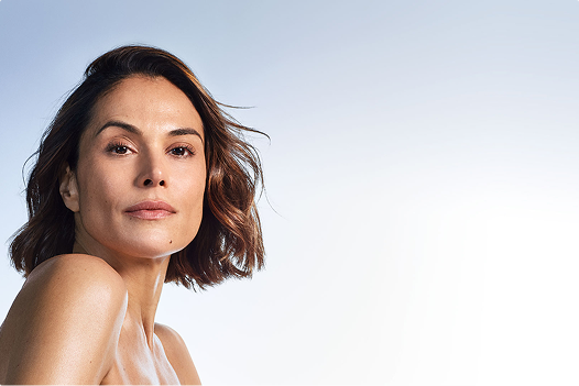 Model with smooth, healthy-looking skin showcasing natural skincare results